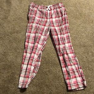 pink and white pj pants, black plaid designs